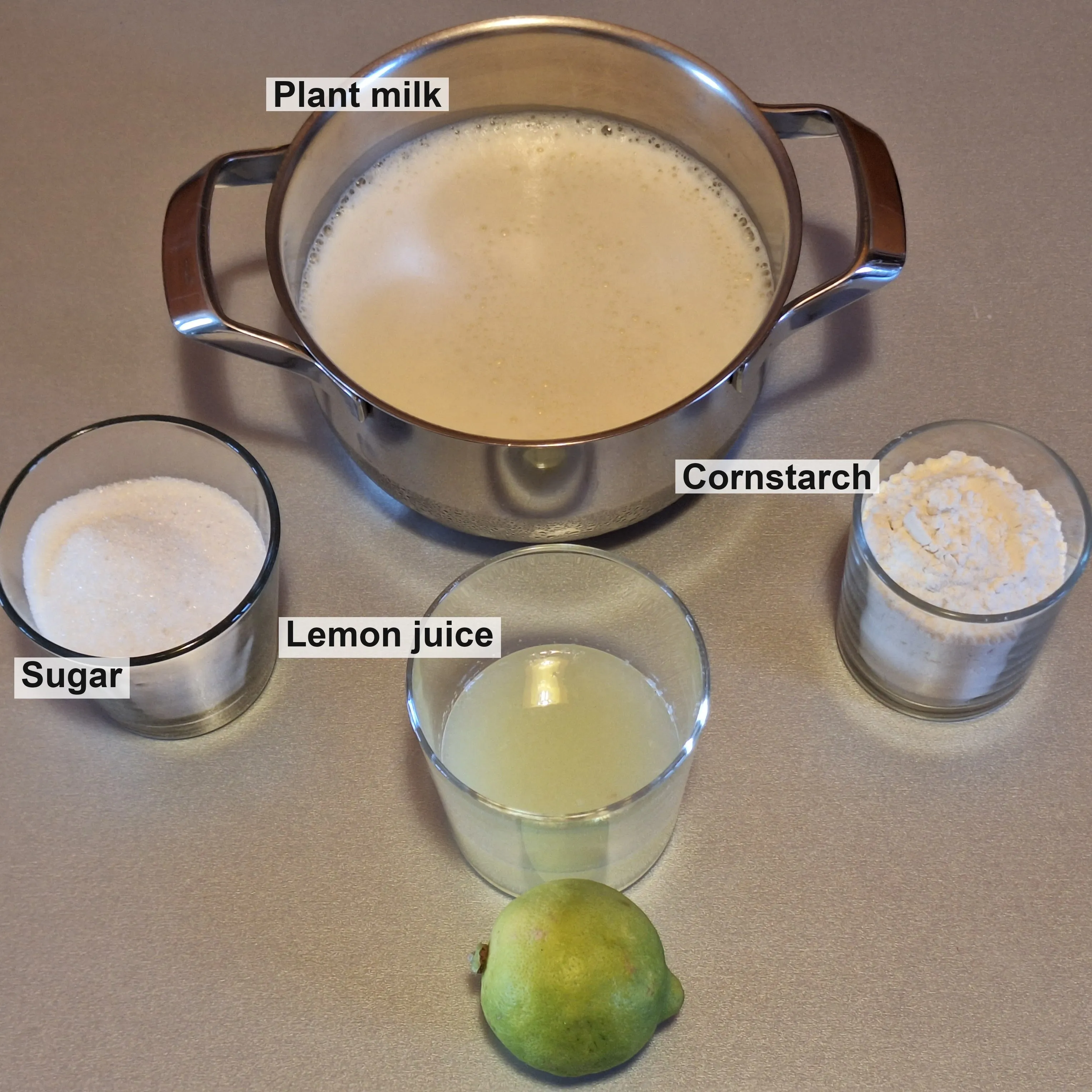 The lemon custard ingredients: plant milk, sugar, cornstarch and lemon juice.