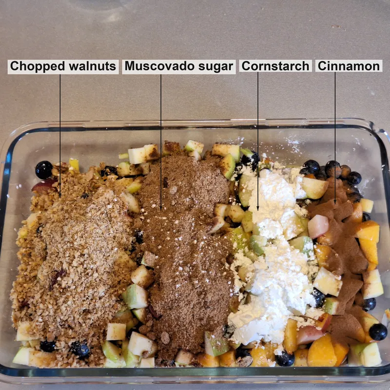 Chopped fruit, with (from left) chopped nuts, whole sugar, corn starch, cinnamon