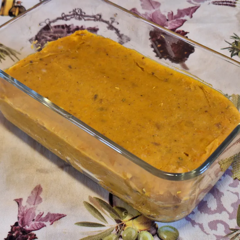 The pumpkin and bean mixture pressed into a tin, ready for the fridge.